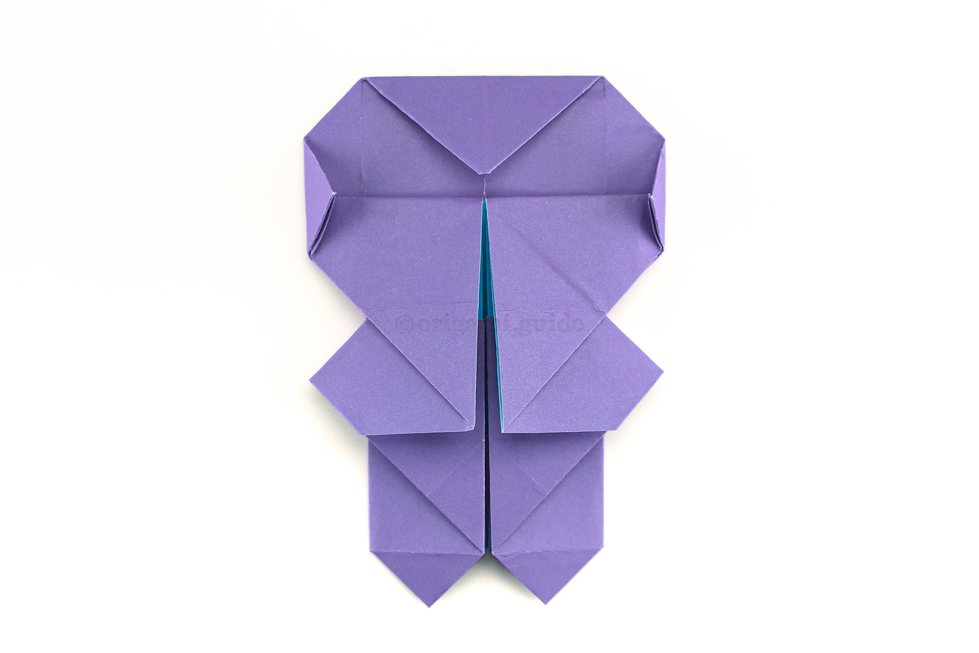 Step 42 - Fold the left and right points a little, to create a more rounded head shape.