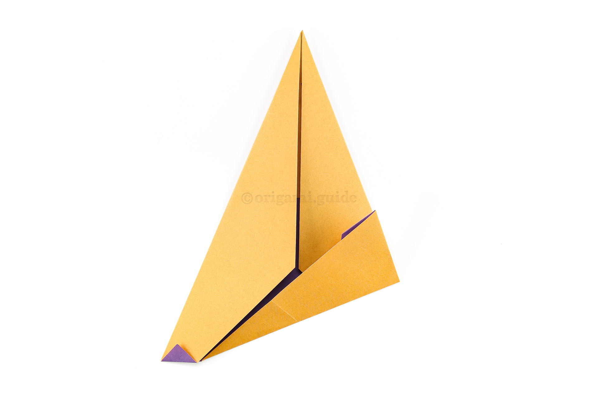 Step 9 - Fold the lower right point diagonally up, using the existing angle of the left flap as a guide as shown.
