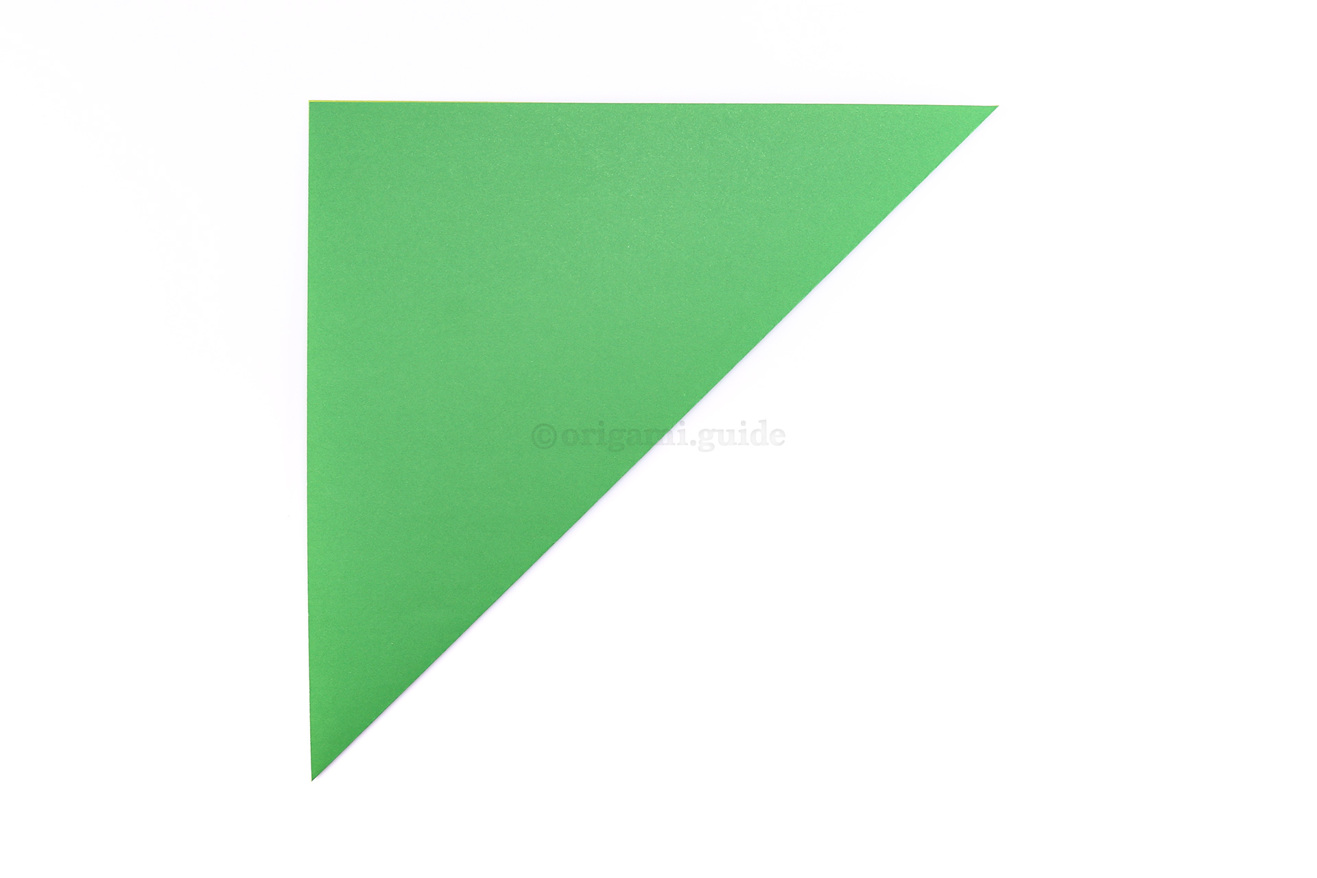 Step 3 - Start by folding the bottom right corner up to the top left corner.