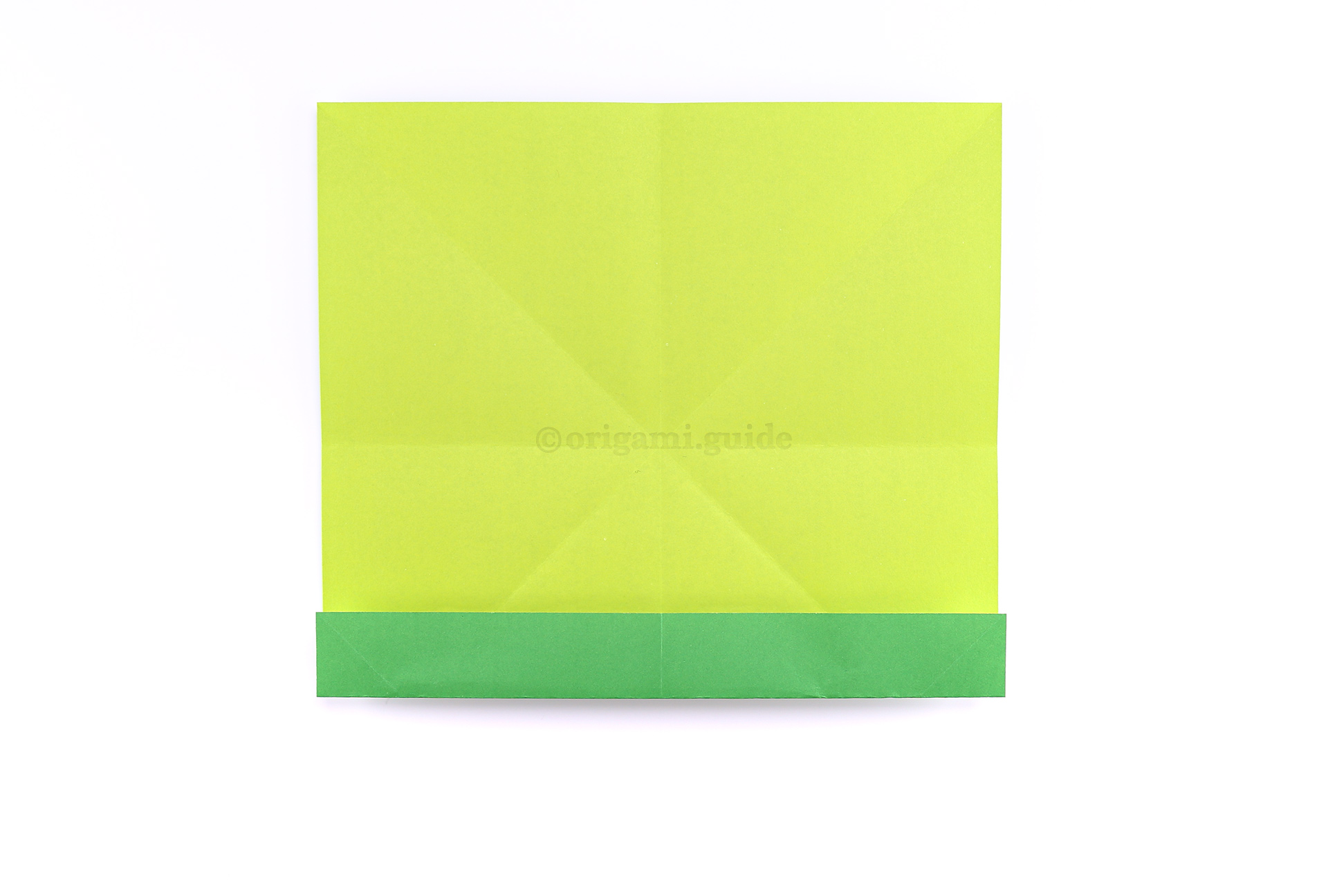 Step 13 - Now, fold the bottom edge up to meet the crease you made in the previous step.