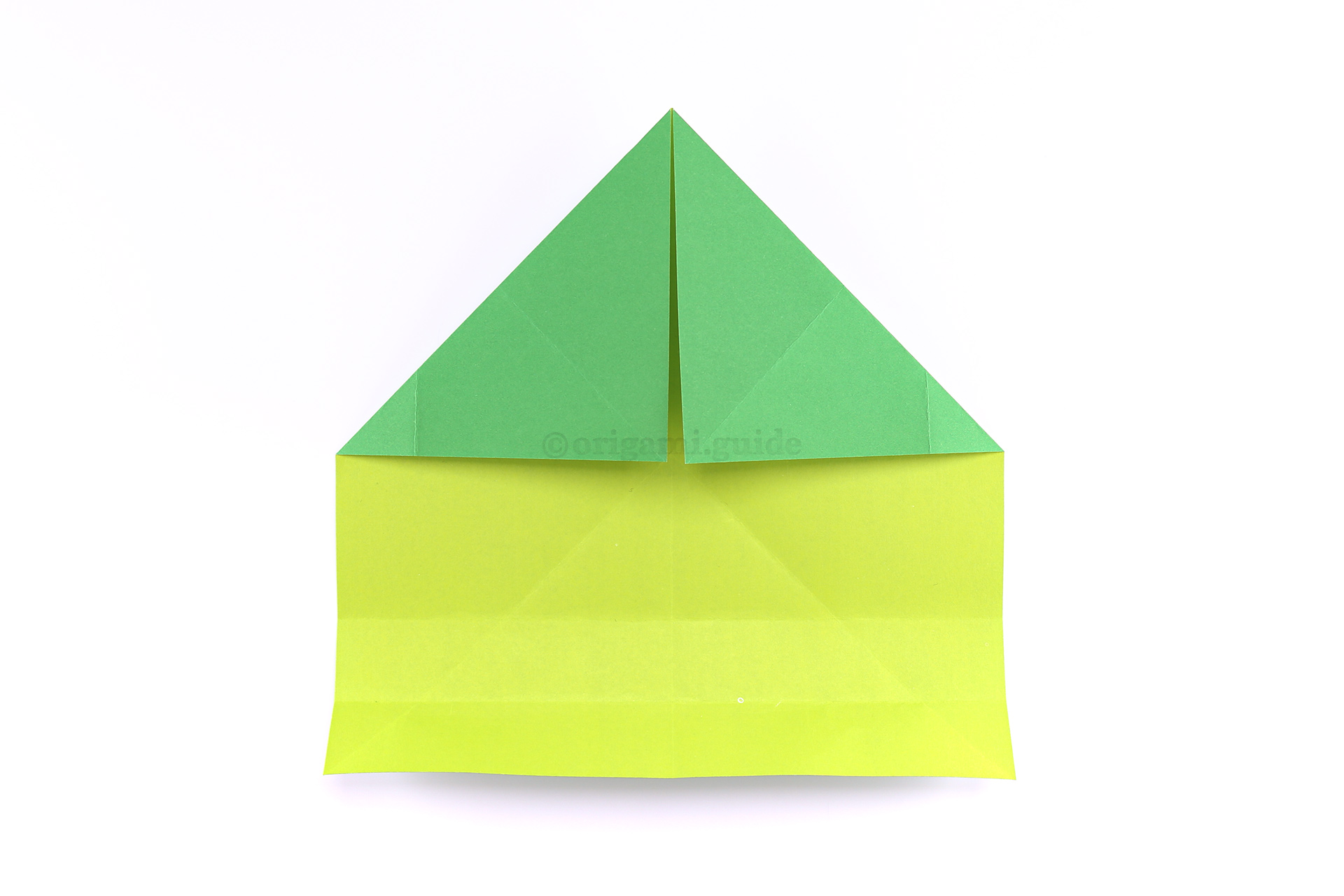 Step 15 - Unfold the last step, and then fold the top right and top left corners diagonally down as shown.