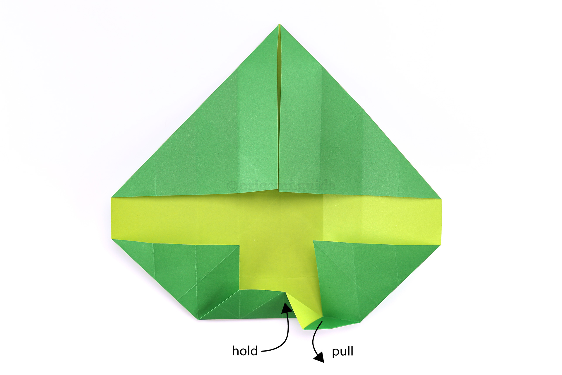 Step 25 - While holding the lower triangle section, pull out the corner indicated.