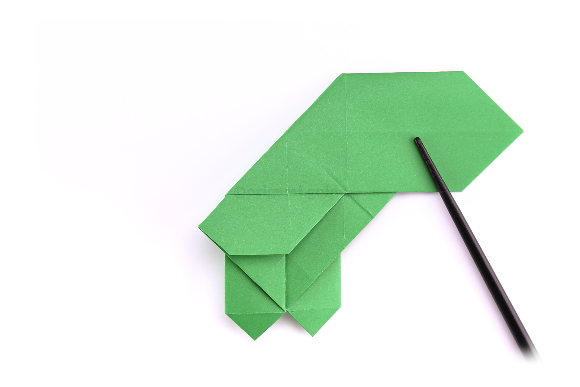 Step 33 - Next we are folding the opposite diagonal crease.