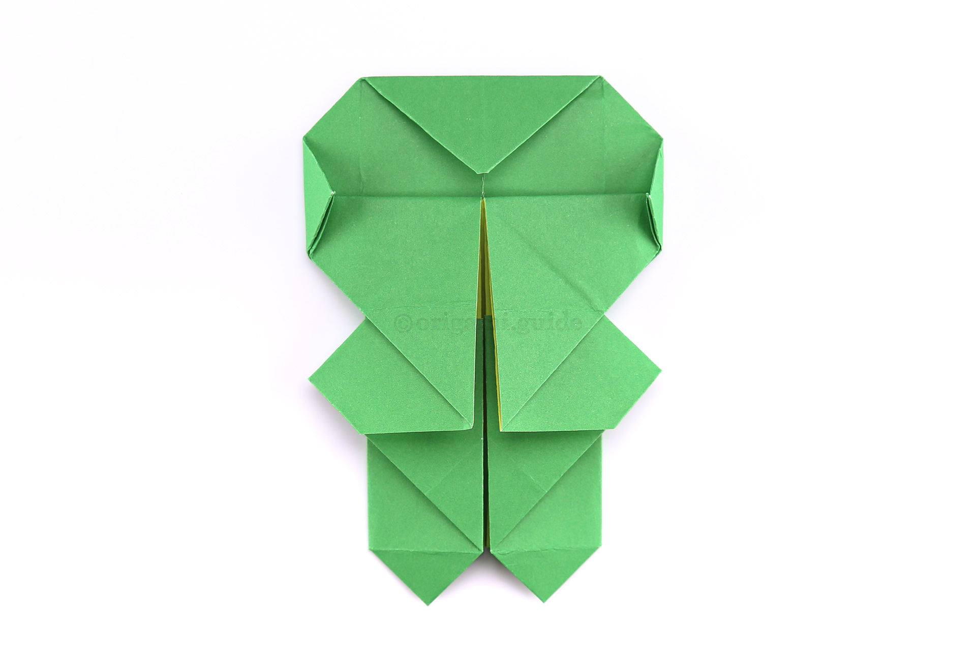 Step 42 - Fold the left and right points a little, to create a more rounded head shape.