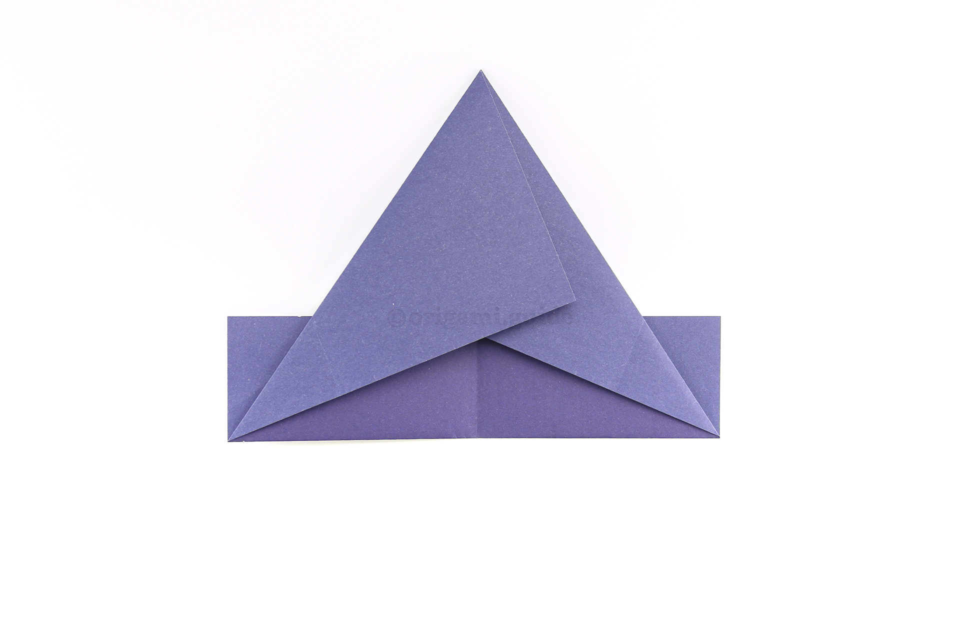 Step 9 - Fold the left point diagonally to match.